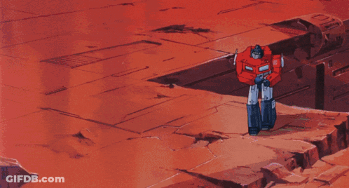 Two Robots Standing On Red Background GIF