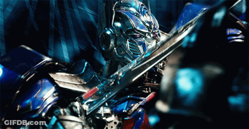 Two Robots Standing With Letter O On Chest GIF
