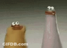Two Salt And Pepper Shakers With Googly Eyes On Top Of Them GIF