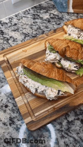 Two Sandwiches On Wooden Cutting Board GIF