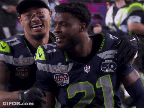 Two Seahawks Players Hugging GIF