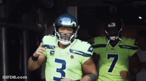 Two Seahawks Players Number 3 And 7 Are Running Out Of The Tunnel GIF