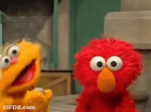 Two Sesame Street Characters Elmo And Oscar Are Standing Next To Each Other . GIF