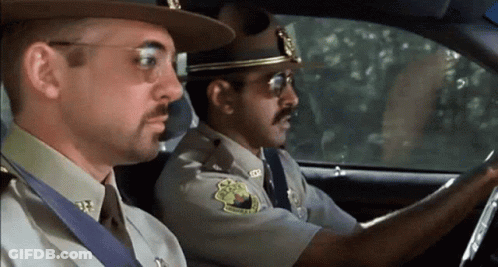 Two Sheriffs Sitting In Car With Texas Patch GIF