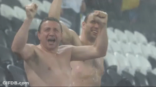 Two Shirtless Men Are Cheering With The Words Rain Delay Written On The Bottom GIF