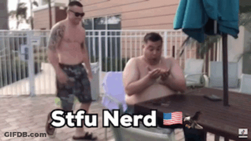 Two Shirtless Men Are Sitting At A Table With The Words Stfu Nerd Written On The Bottom GIF