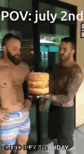 Two Shirtless Men Are Standing Next To Each Other Holding A Stack Of Cakes . GIF