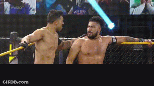 Two Shirtless Men In Front Of 203Live Screen GIF