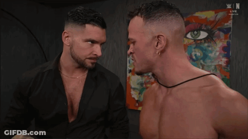 Two Shirtless Men In Front Of Woman Painting GIF
