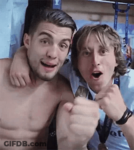 Two Shirtless Men One With Fist Raised GIF