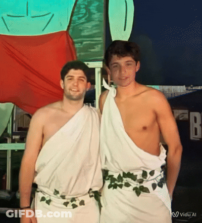 Two Shirtless Men Posing In Front Of FB Sign GIF