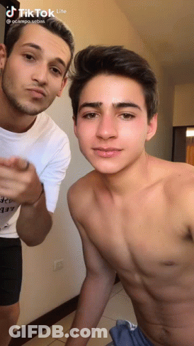 Two Shirtless Men Standing In Room GIF