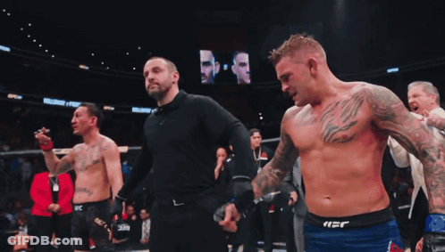 Two Shirtless Men Standing On Field GIF