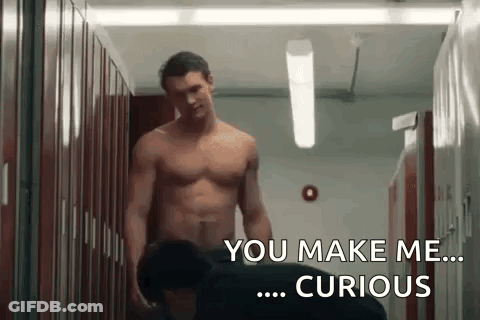 Two Shirtless Men Talking In Locker Room GIF