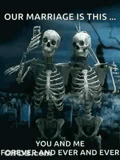Two Skeletons Are Standing Next To Each Other In A Cemetery Taking A Selfie . GIF