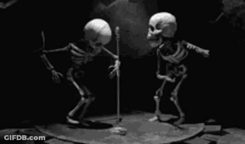 Two Skeletons Standing Next To Microphone GIF