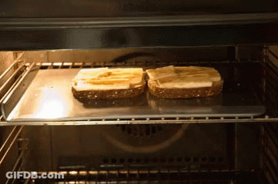 Two Slices Of Bread Toasting In Oven GIF