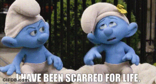 Two Smurfs Are Sitting Next To Each Other On A Bed . GIF