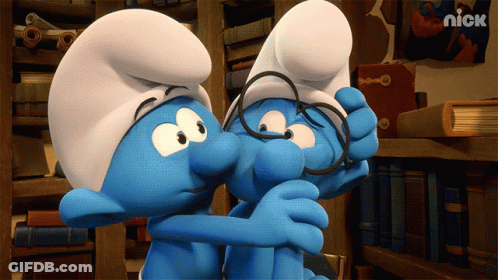 Two Smurfs Wearing Glasses Are Hugging Each Other With A Nick Logo In The Corner GIF