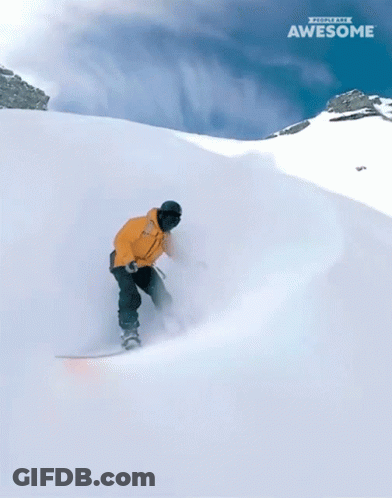 Two Snowboarders Are Going Down A Snow Covered Slope And The Word Awesome Is On The Bottom Right GIF