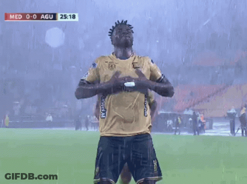 Two Soccer Players Are Celebrating A Goal During A Game Between Med And Agui GIF