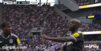 Two Soccer Players Are Celebrating A Goal In Front Of A Crowd And The Score Is Tot 0-2 New GIF