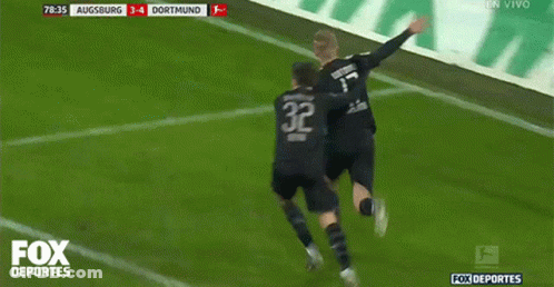Two Soccer Players Are Celebrating A Goal With The Fox Deportes Logo Behind Them GIF