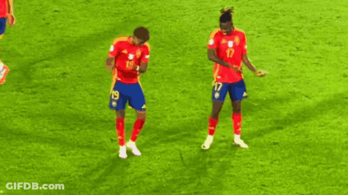 Two Soccer Players Are Dancing On The Field And One Has The Number 17 On His Shorts GIF