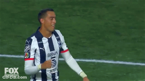 Two Soccer Players Are Giving Each Other A High Five On A Field Sponsored By Fox GIF