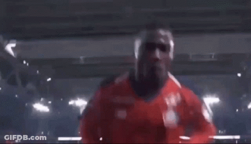 Two Soccer Players Are Giving The Peace Sign While Standing Next To Each Other . GIF