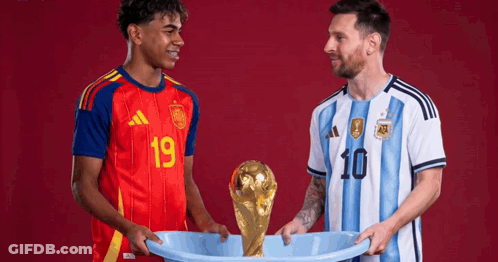 Two Soccer Players Are Holding A Trophy And One Has The Number 10 On His Jersey GIF