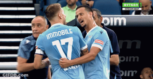 Two Soccer Players Are Hugging And One Has The Number 17 On His Back GIF