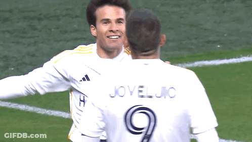 Two Soccer Players Are Hugging And One Has The Number 9 On His Jersey GIF