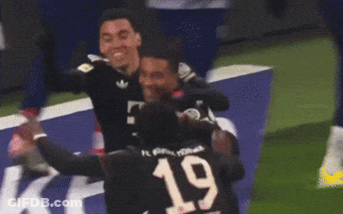 Two Soccer Players Are Hugging Each Other And One Has The Number 1 On His Shirt GIF