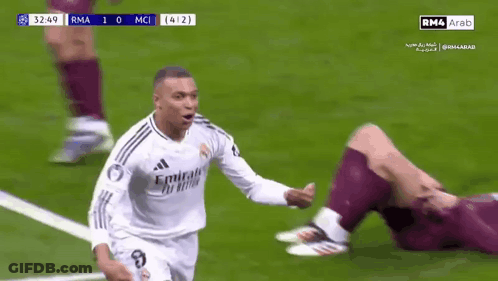 Two Soccer Players Are Hugging Each Other On A Field . GIF