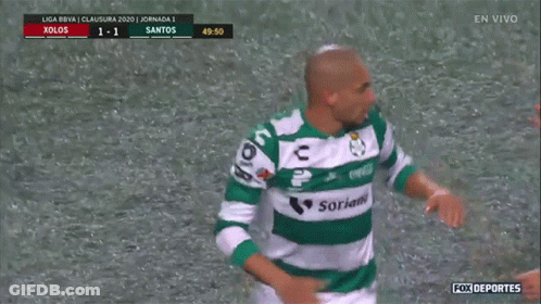 Two Soccer Players Are Hugging Each Other On A Field With Fox Deportes In The Upper Left Corner GIF