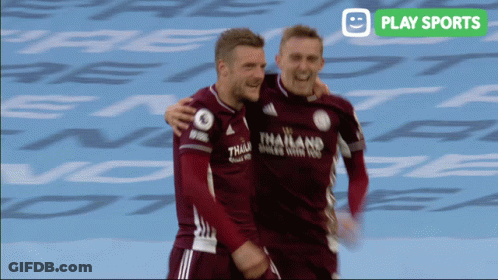 Two Soccer Players Are Hugging Each Other With A Play Sports Logo In The Background GIF