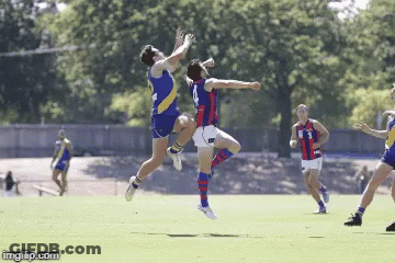 Two Soccer Players Are Jumping In The Air While One Has The Number 3 On His Jersey GIF