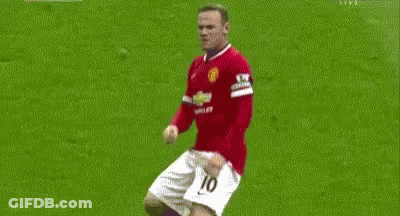 Two Soccer Players Are Playing A Game On A Field . GIF