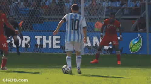 Two Soccer Players Are Playing In Front Of A Large Fifa Logo GIF