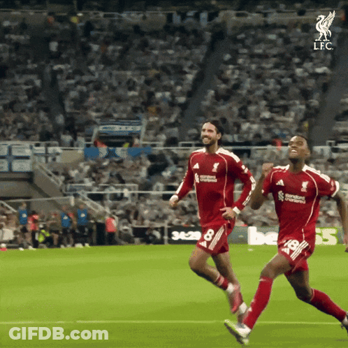 Two Soccer Players Are Running On A Field And One Of Them Is Wearing A Jersey That Says Standard Chartered GIF