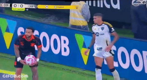 Two Soccer Players Are Standing In Front Of A Banner That Says ' Coop ' On It GIF
