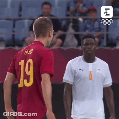 Two Soccer Players Are Standing Next To Each Other And One Has The Number 19 On His Shirt GIF