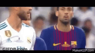 Two Soccer Players Are Standing Next To Each Other In A Crowd . GIF
