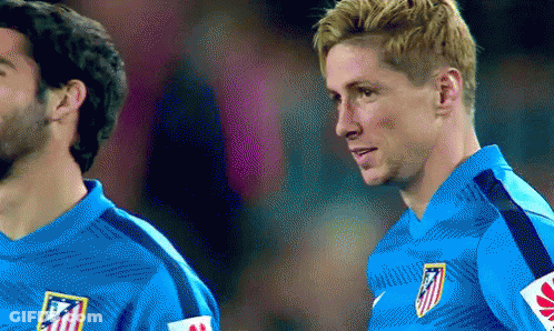 Two Soccer Players Are Standing Next To Each Other In Blue Jerseys GIF