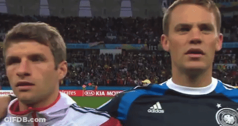 Two Soccer Players Are Standing Next To Each Other In Front Of A Kia Kia Motors Advertisement GIF