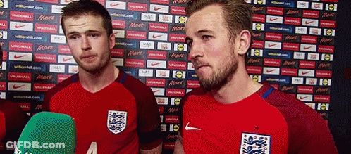 Two Soccer Players Are Standing Next To Each Other In Front Of A Wall With Nike Advertisements GIF