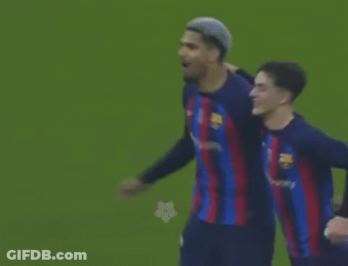 Two Soccer Players Are Standing Next To Each Other On The Field . GIF