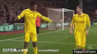 Two Soccer Players Are Standing On A Field With A Makeagif.com Website In The Corner GIF