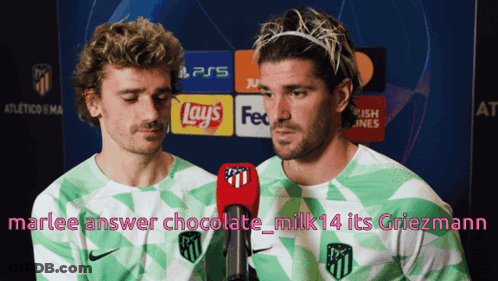 Two Soccer Players Are Talking Into Microphones In Front Of A Sign That Says Ps5 GIF